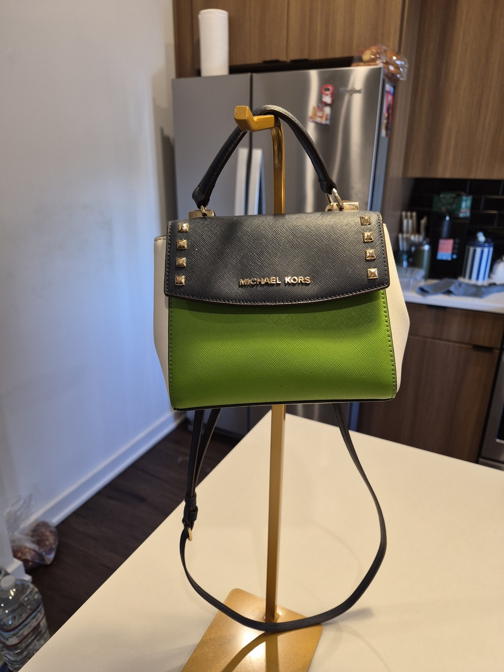 Michael Kors Karla Studded Mini Convertible Crossbody Bag in a navy, jungle gree